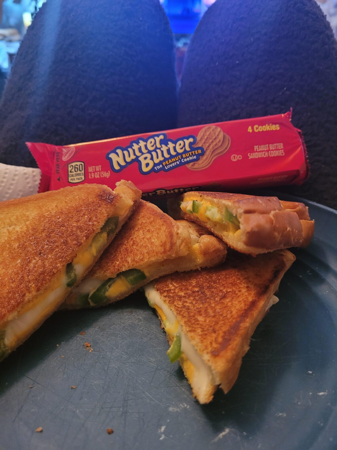 White and yellow American with fresh jalapeños on potato bread.