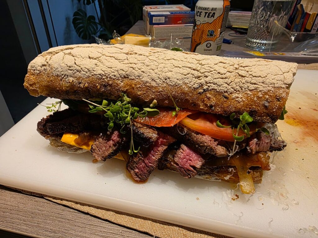 Steak aioli parmigiano sandwich with mushrooms and onion