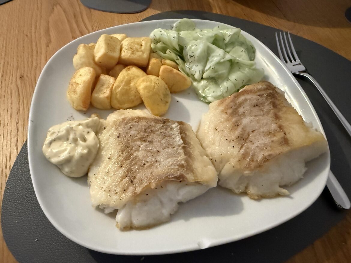 Fried cod with potatoes and cucumber salad
