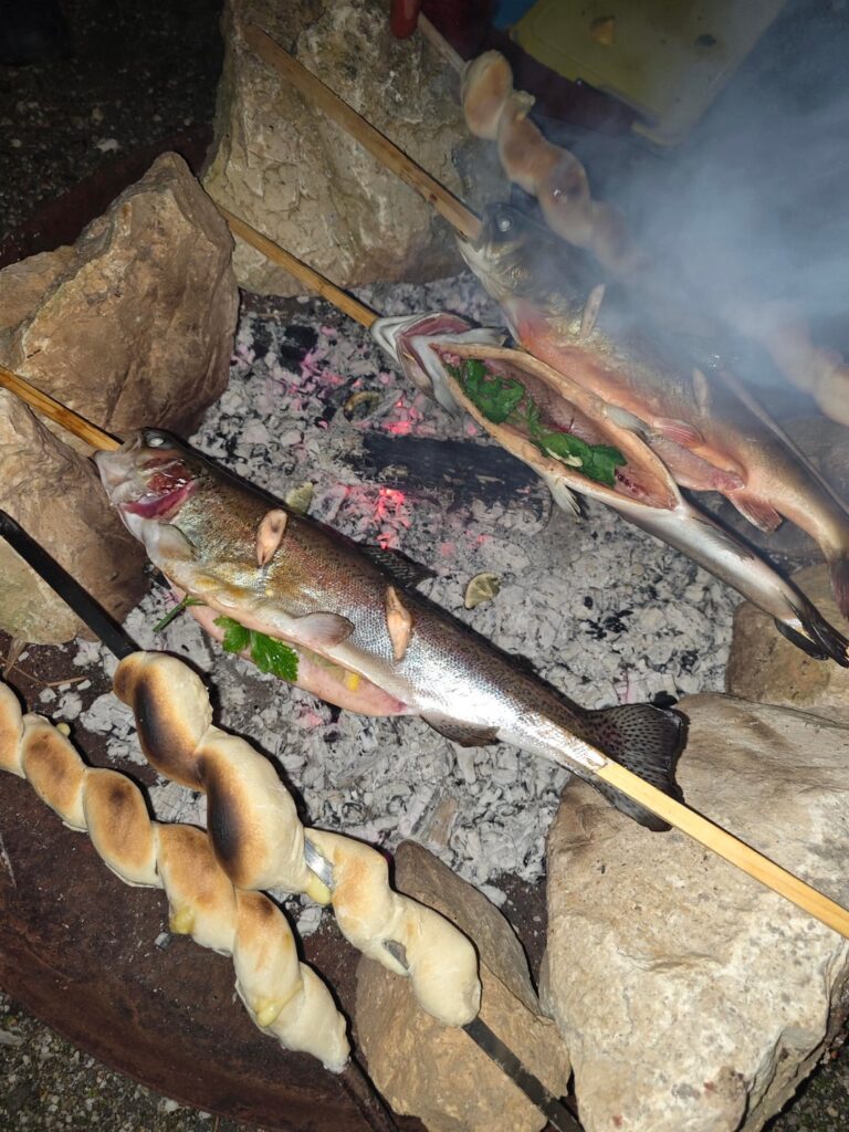 Steckerlfisch - tradional Bavarian fish grilled on a wooden stick