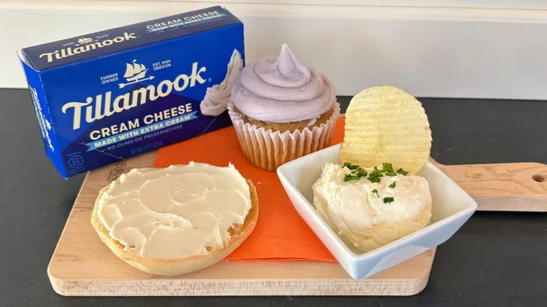 Tillamook 8-ounce cream cheese brick next to cupcake, bagel, and onion dip