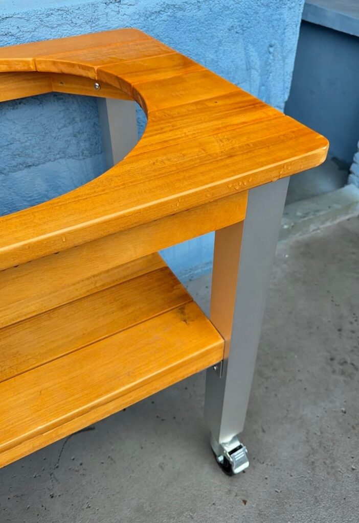 Aluminum alloy legs paired with an African teak tabletop — the perfect match for a Big Green Egg table.