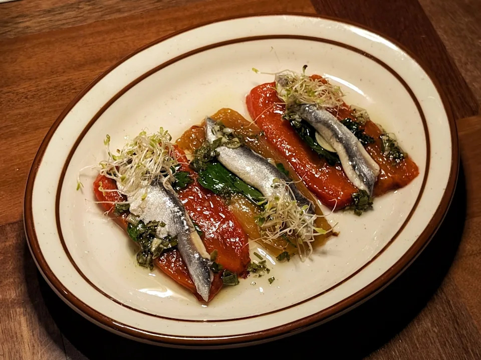 Spanish white anchovies on roasted peppers are a palate-opening starter. — Picture by Ethan Lau