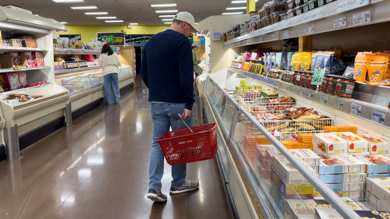 A man browsing the Trader Joe's freezer section