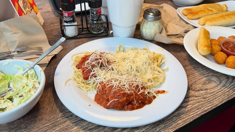 A plate of pasta on a table at Fazoli's