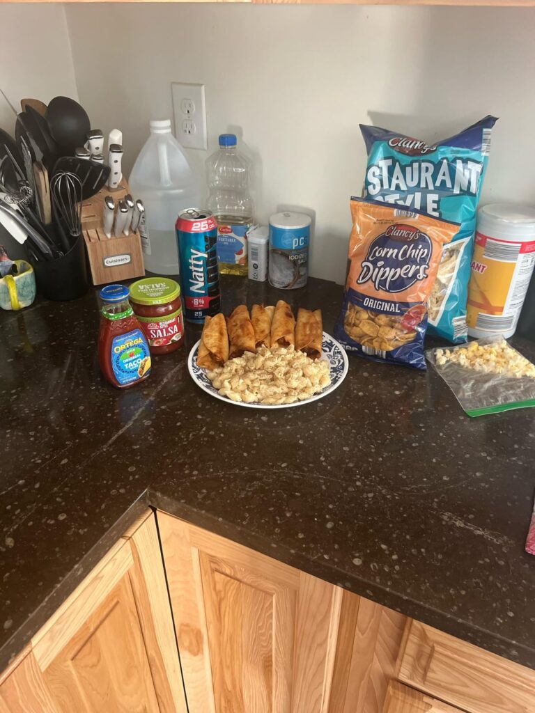 Made a shit load of fried chicken taquitos. Box white cheddar Mac and cheese shells and some salsa with corn chips!
