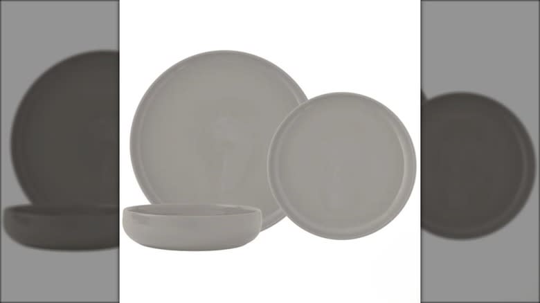 Dinnerware set with two gray plates in different sizes and shallow bowl.
