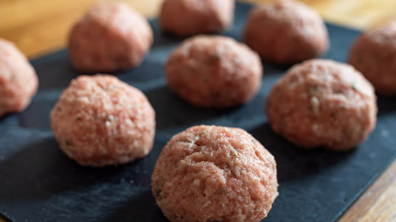 Meatballs on a blue slate