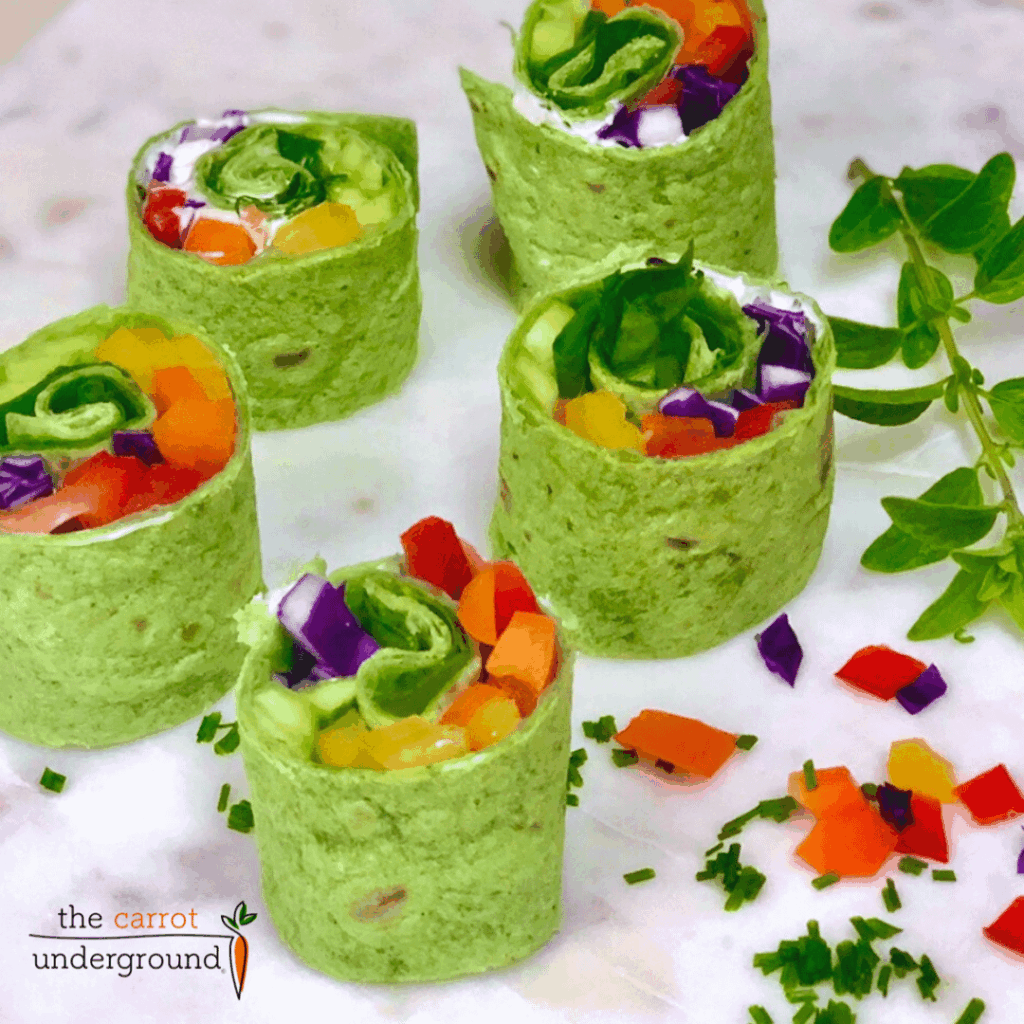Vegan Rainbow Wraps 🌈 ☘️ fresh veggies rolled in spinach tortillas - they're magically delicious!