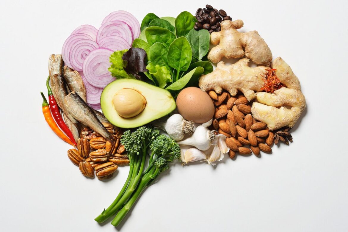 What to eat if you have ADHD, according to experts Image of a variety of healthy foods in the shape of a human brain