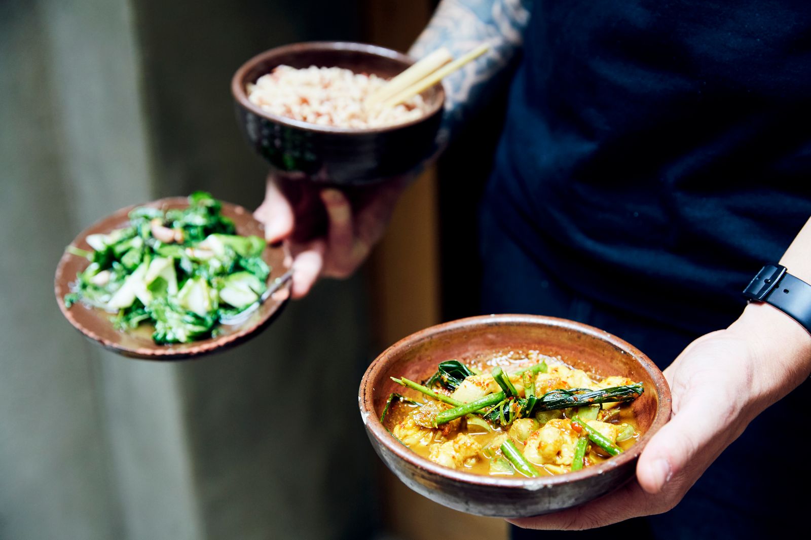 Image may contain Wristwatch Human Person Food Bowl Meal Plant and Dish
