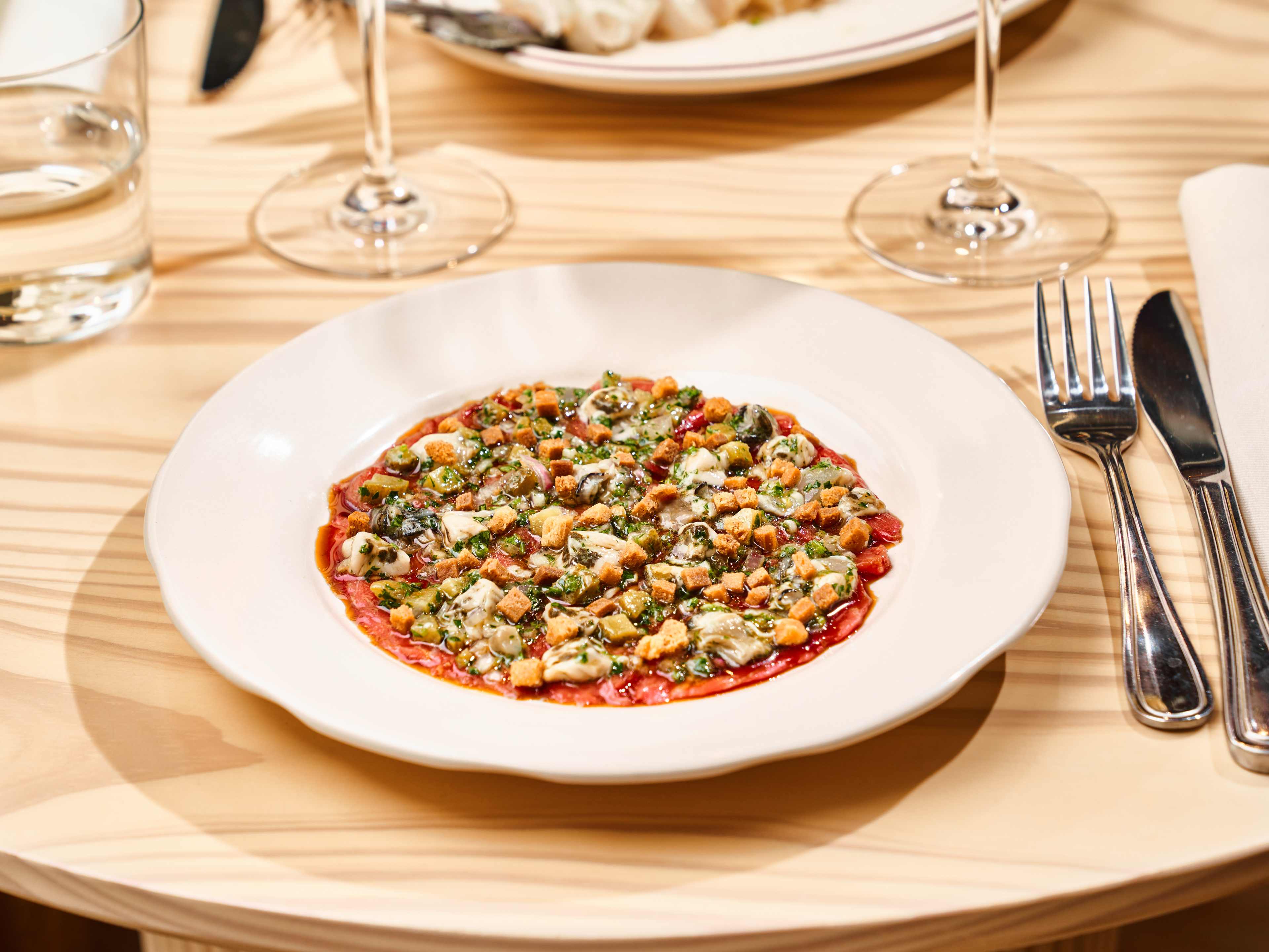 surf and turf crudo on plate