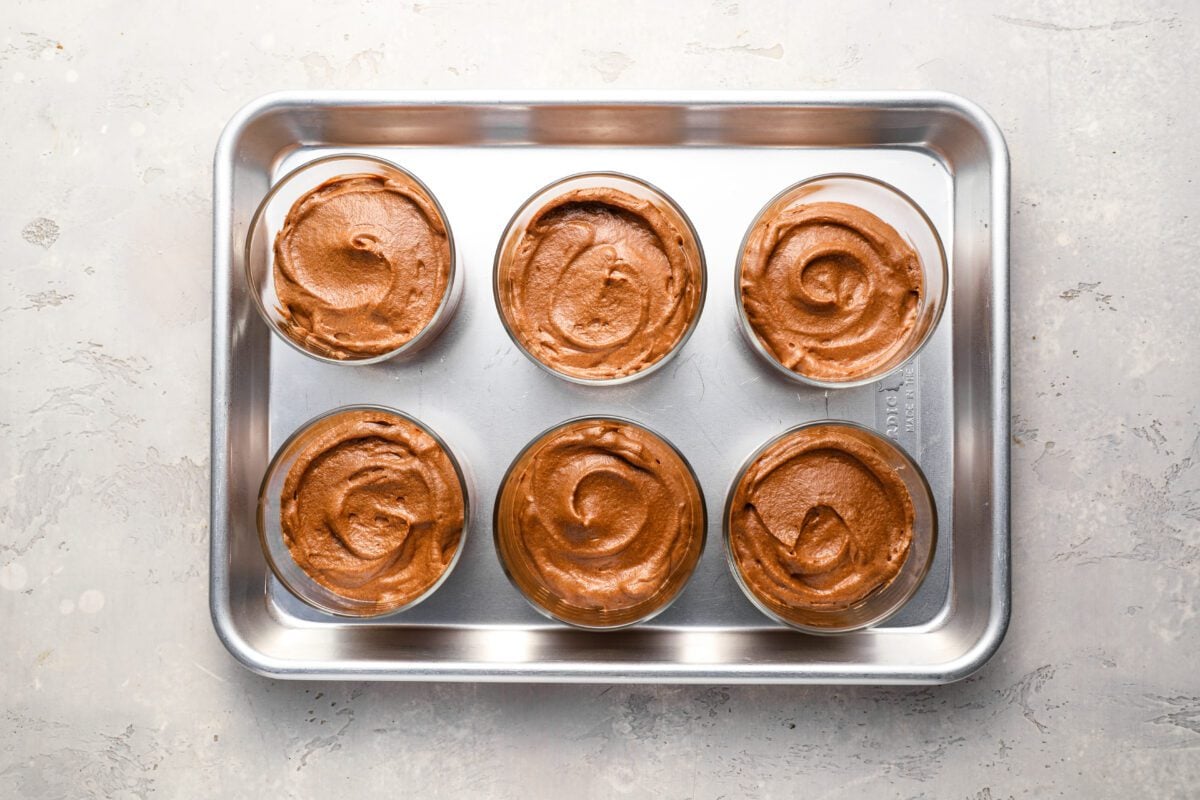 chocolate mousse in 6 glasses on baking sheet