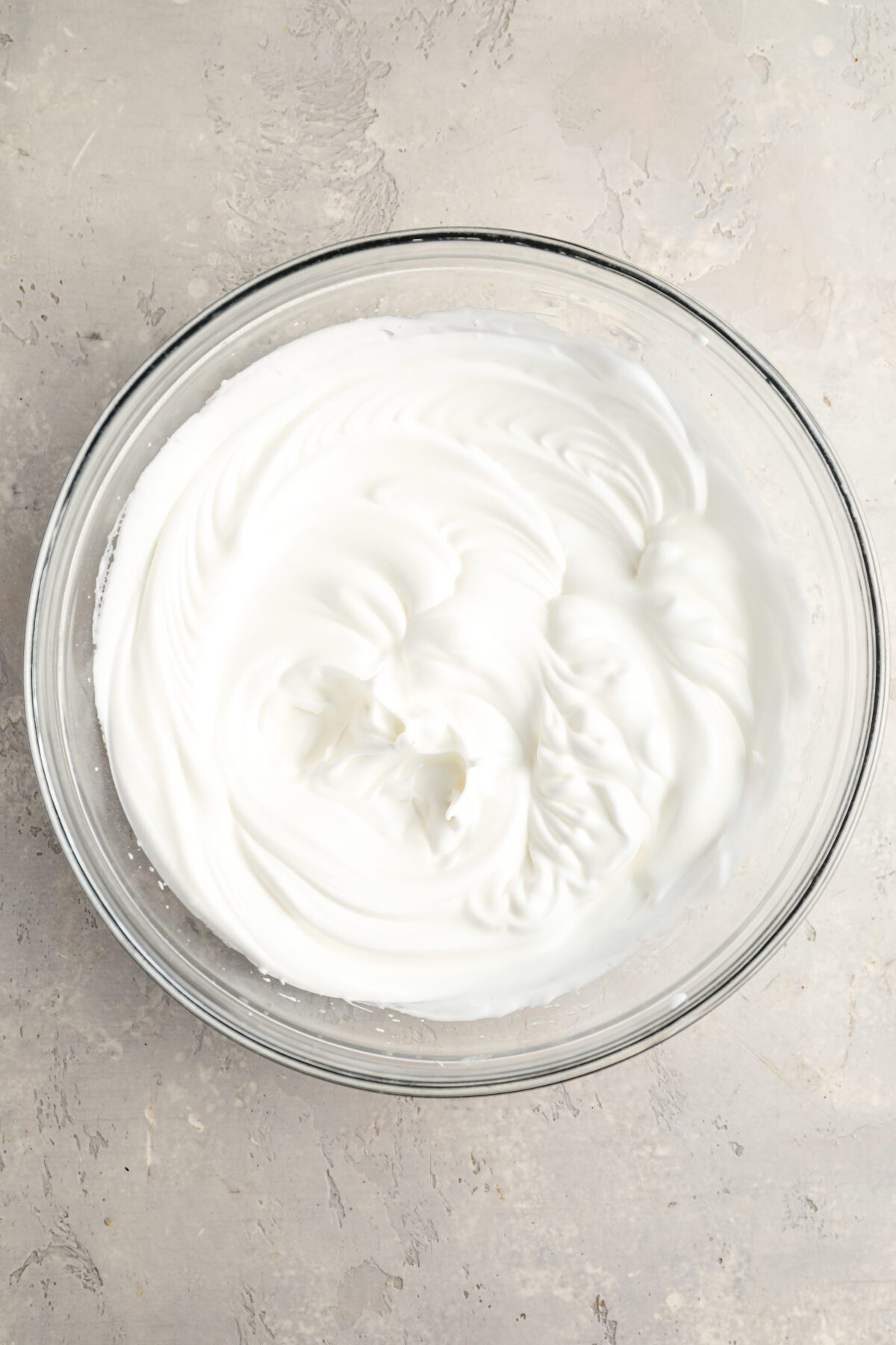 medium bowl with egg whites and cream of tartar and sugar beaten to stiff peaks