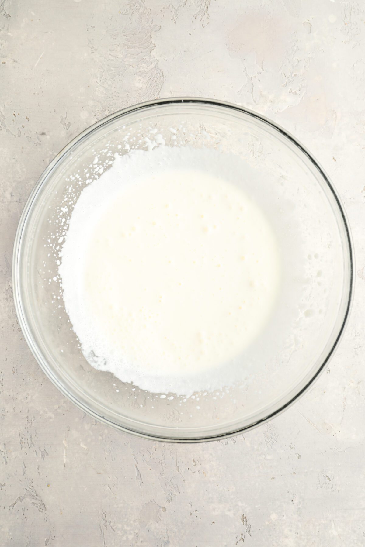 glass bowl with slightly thickened heavy cream