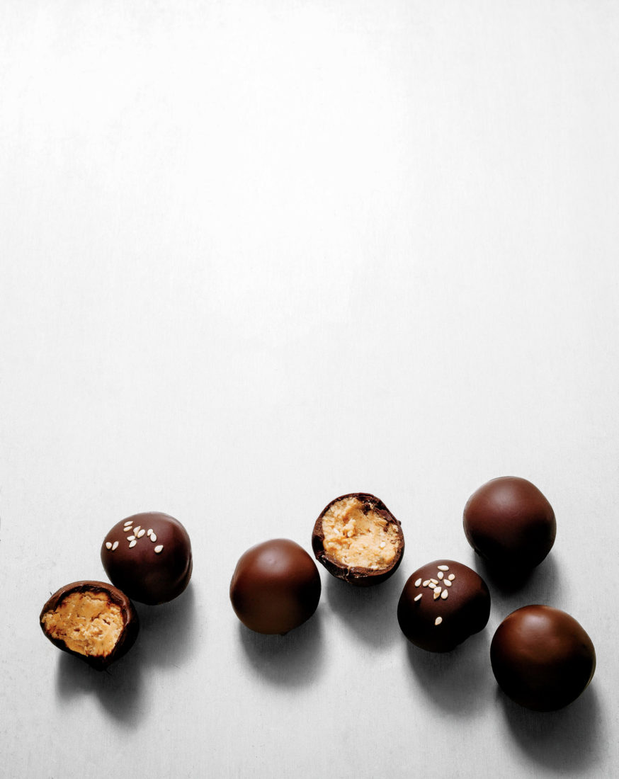 BENNE SEED PEANUT BUTTER BALLS
Benne seeds and chocolate kicked up with chile raise the bar on a traditional party-time treat.
> Get the recipe