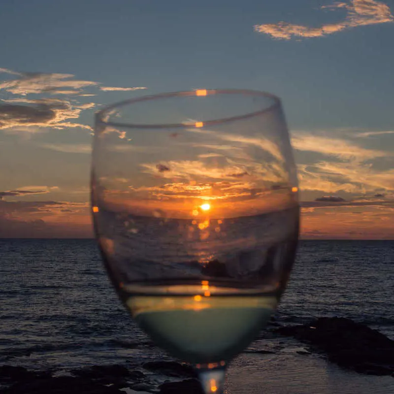 Glass Of Wine Pictured At Sunset, Italy