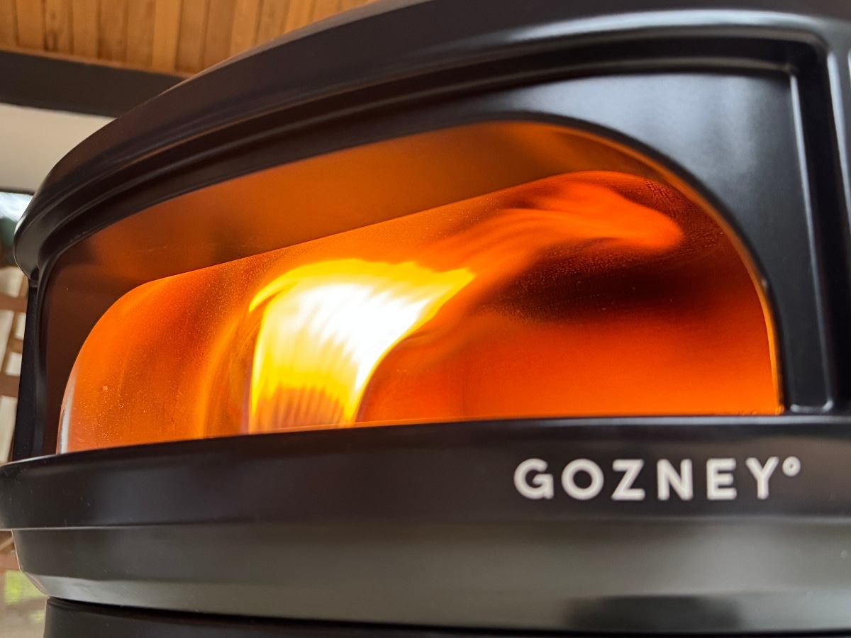 Gozney Arc Lite lateral rolling flame cooking a 12-inch Neapolitan pizza