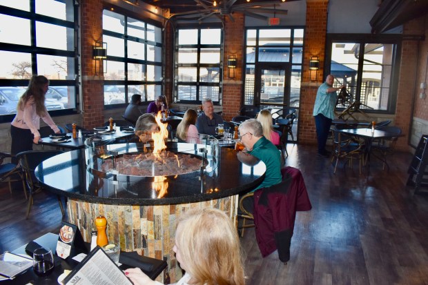 The owners of VAI's Italian Inspired Kirchen + Bar in Naperville enclosed this patio, making it an all-weather room. In warm months, the garage doors are opened to enjoy the fresh air. (Steve Metsch/Naperville Sun)