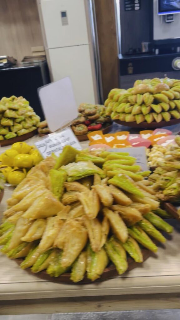Fresh trays of pistachio and walnut baklava in Yerevan, Armenia