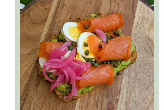 Open-face lox sandwich with boiled egg, pickled cabbage  and capers from Poppyseed Rye