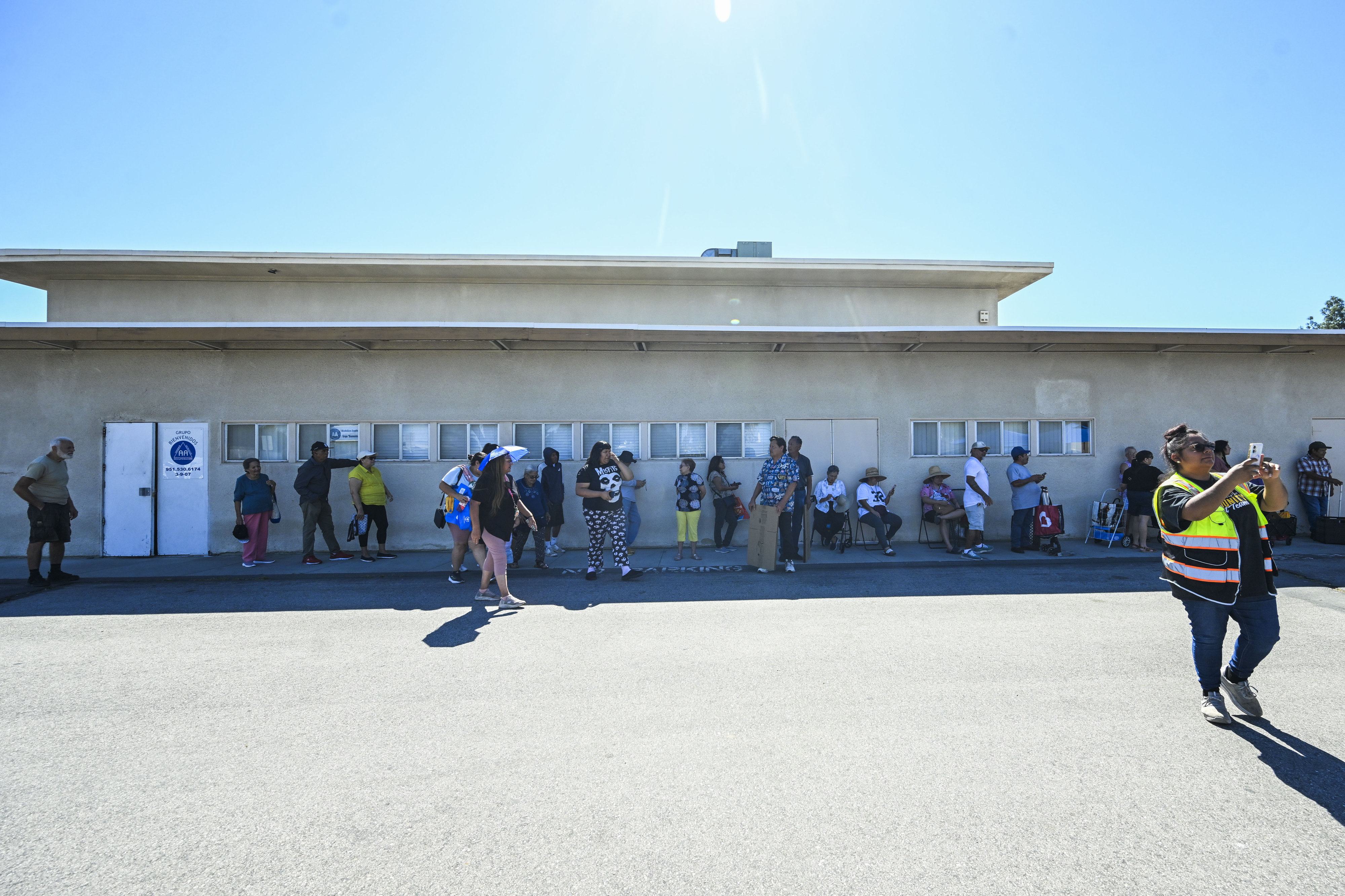 Riverside residents wait in line at the Lighthouse of Hope...