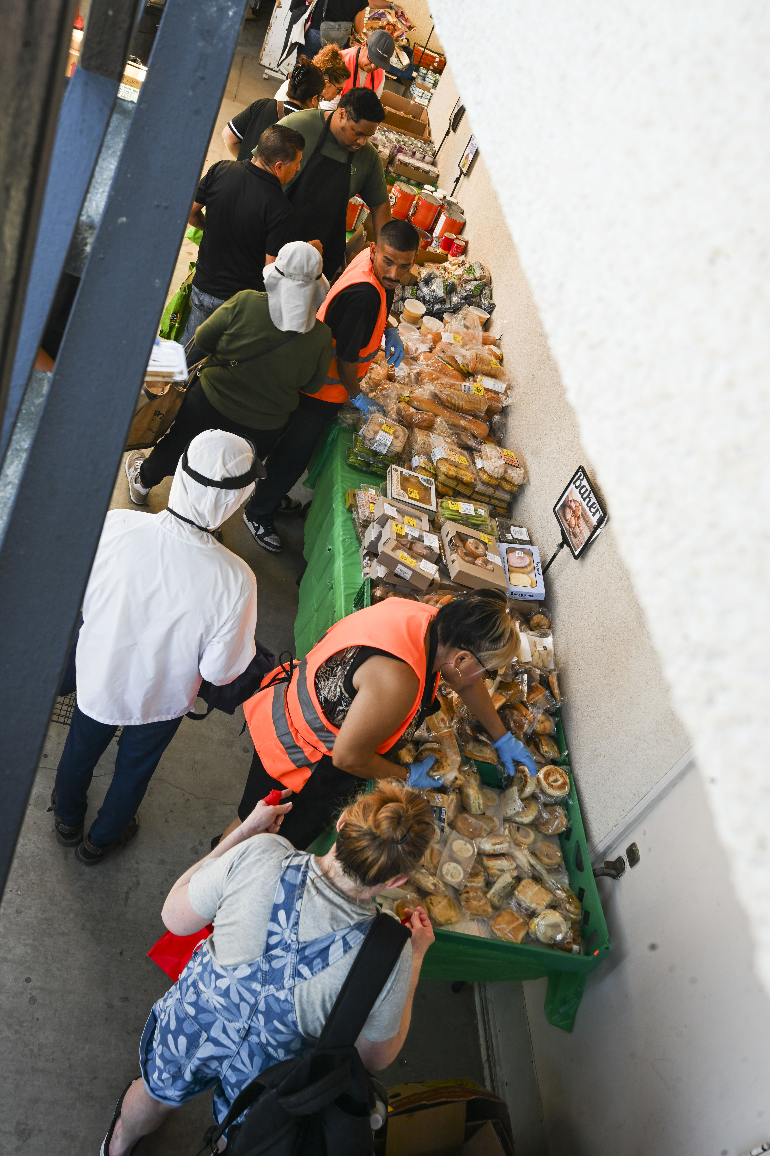 Riverside residents receive fresh food Wednesday, March 18, 2026, at...