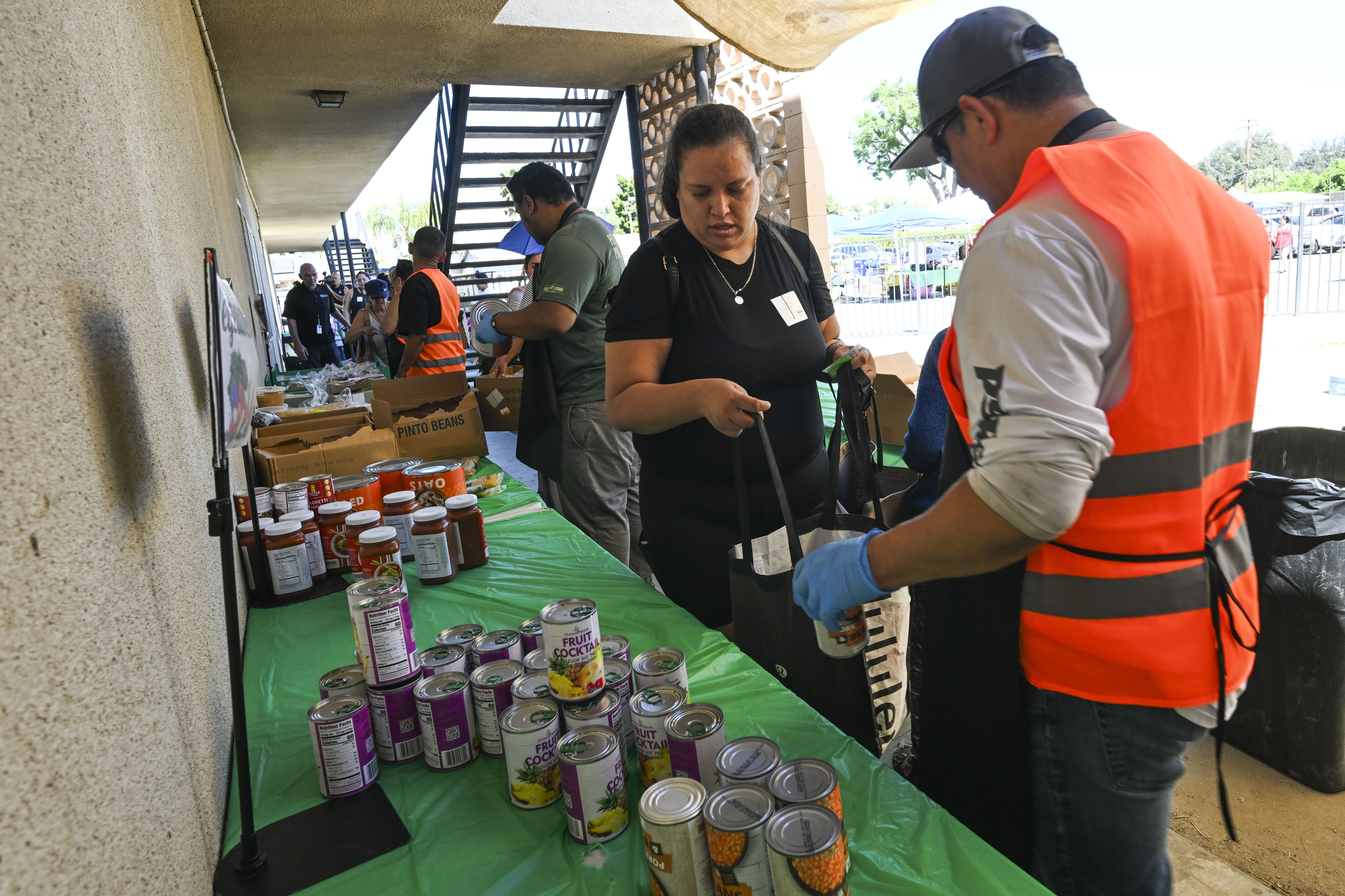 Elizabeth Cruz receives food from the Lighthouse of Hope food...