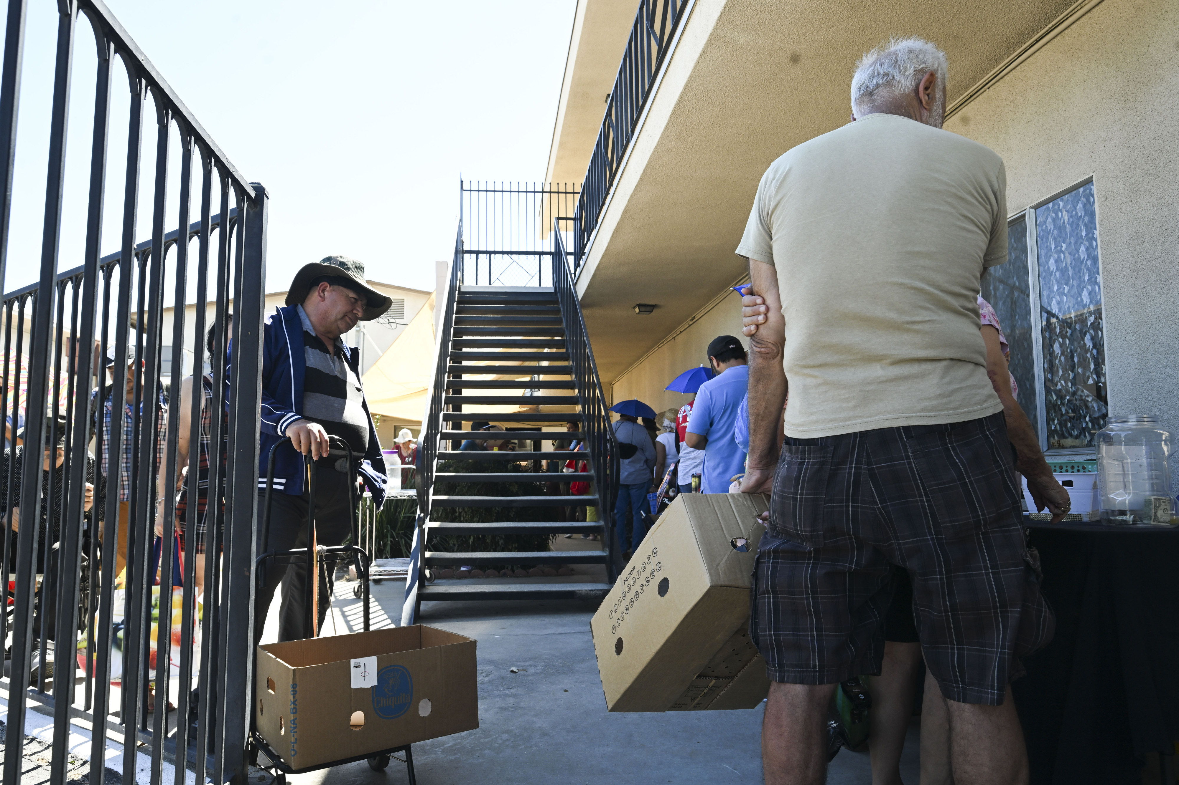 Riverside residents wait in line Wednesday, March 18, 2026, at...
