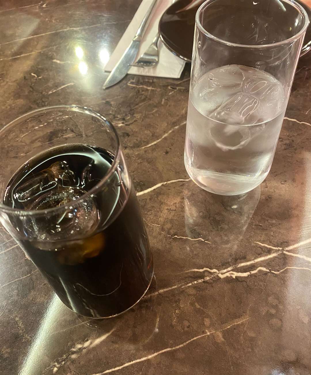 Coke and water with ice