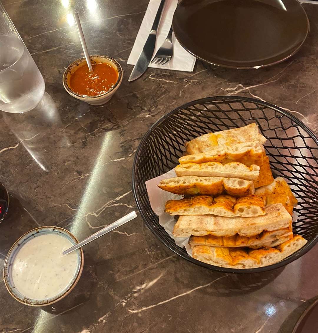 Our complimentary bowl of tomato and herb bread with dips