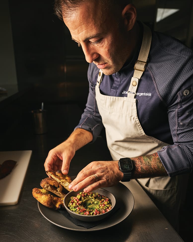 Chef Joey Sergentakis puts the finishing touches on warm smoked-salmon pastrami at Revell Hall in Burlington City, NJ