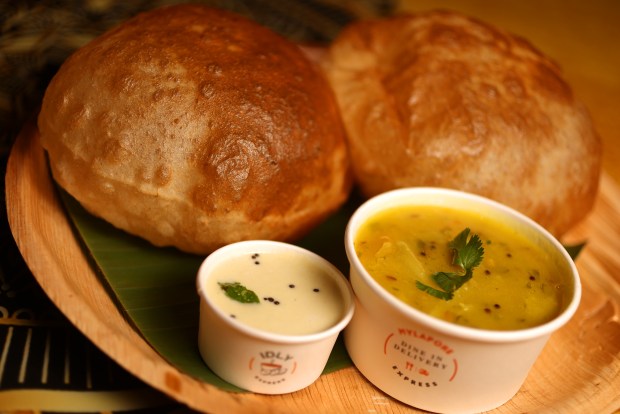 Poori Masala, fried wheat flour balls paired with potato-based masala gravy, is served at Mylapore restaurant in San Jose. (Aric Crabb/Bay Area News Group)