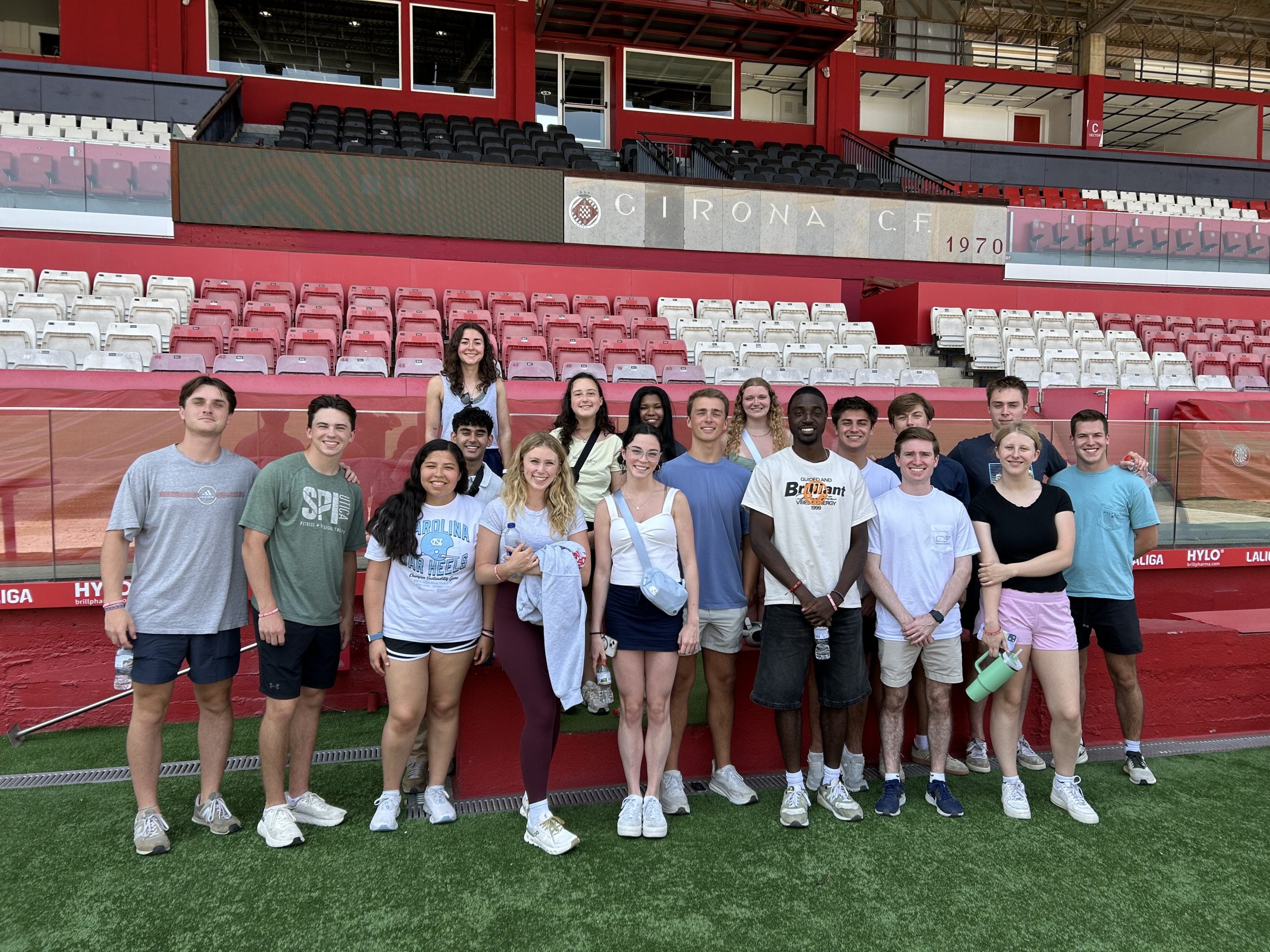 Students in the Smart and Connected Teams pose in a soccer stadium.
