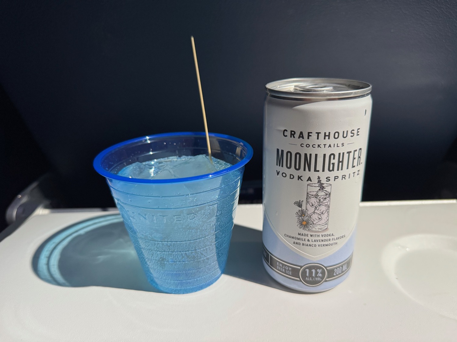 a can of alcohol next to a drink