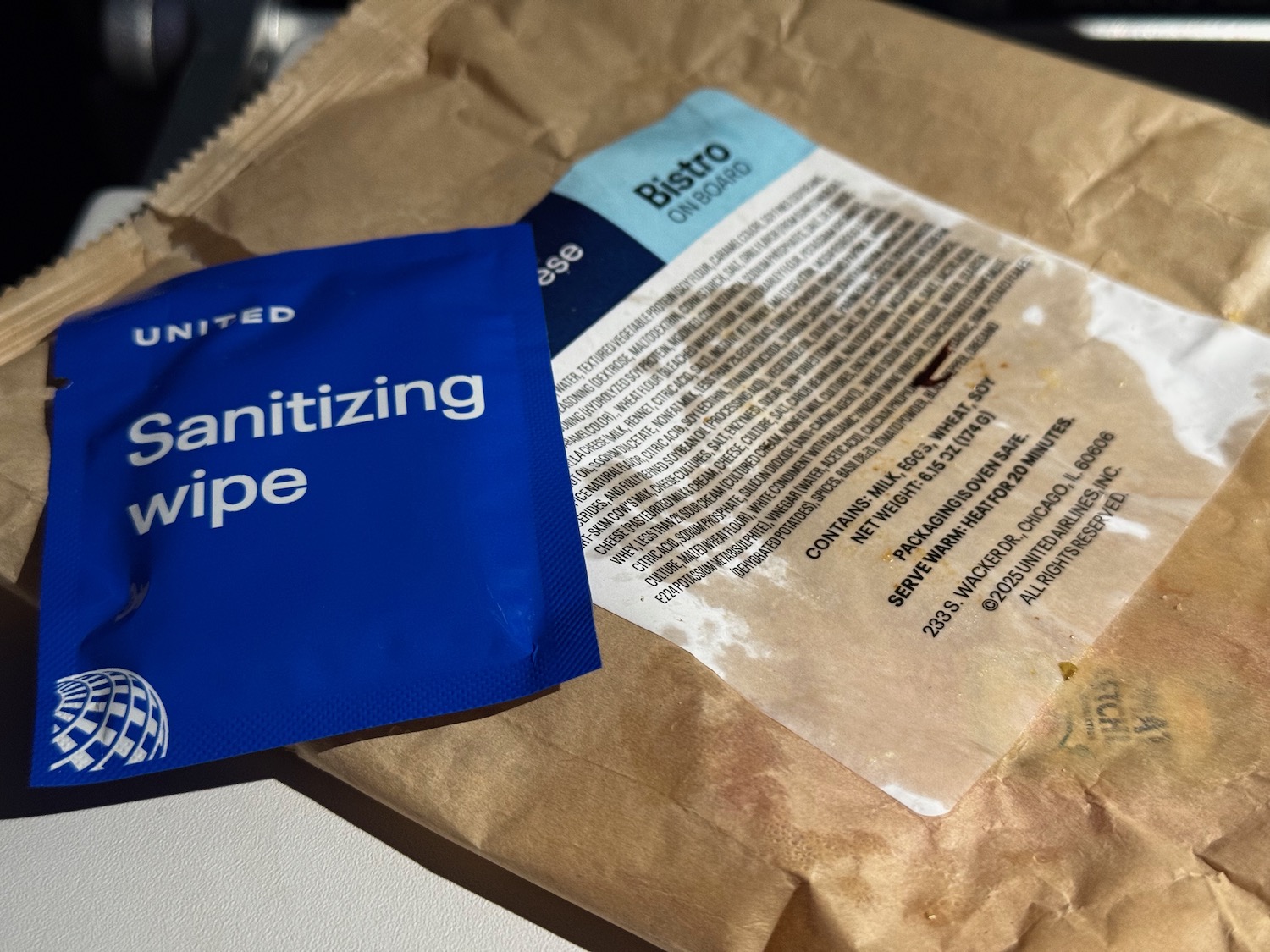 a blue packet and a brown bag