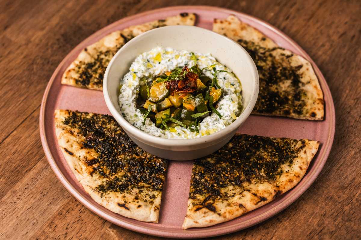 Zaatar Laffah labneh-lime tzatziki, spicy marinated cucumber, tchouma chile crisp