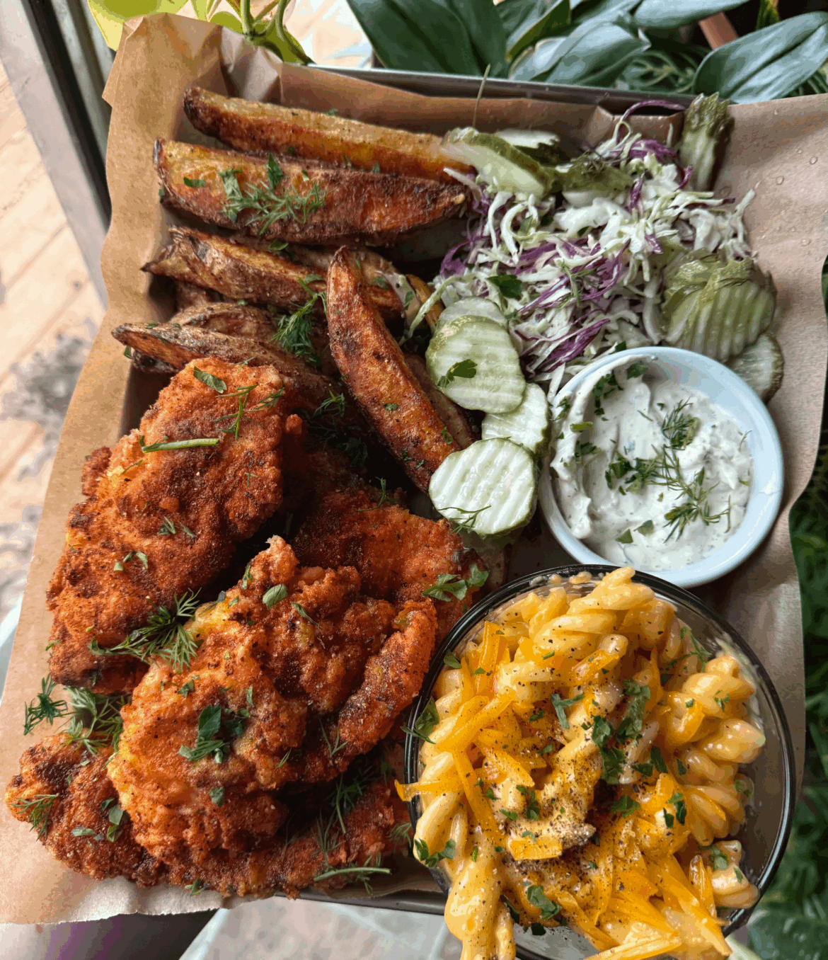 Nashville hot chicken tenders, baked seasoned potato wedges, macaroni and cheese, and slaw + pickles for dinner tonight