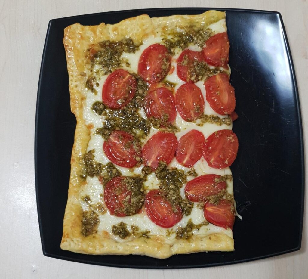 Puff pastry tarts - 1. Kashkaval, tomatoes and pesto. 2. Kashkaval and poppy seeds. 3. Apples (par-cooked in butter, vanilla sugar, cinnamon and a bit of left over strawberry jam) and caramel ice cream. 4. Dried cranberries soaked in orange juice and white chocolate.