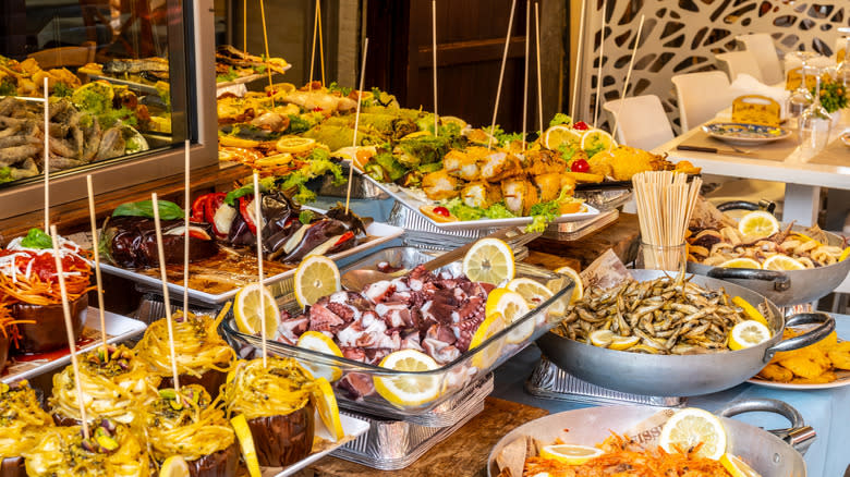 Plates of delicious street food in Palermo, Sicily