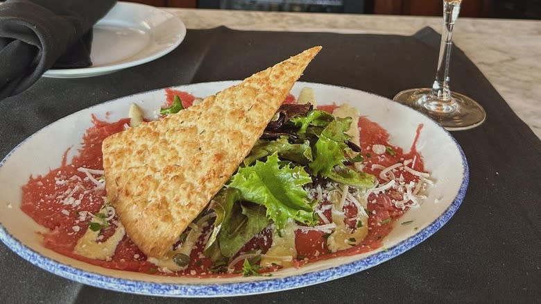 A plate of carpaccio at Brio Italian Grille