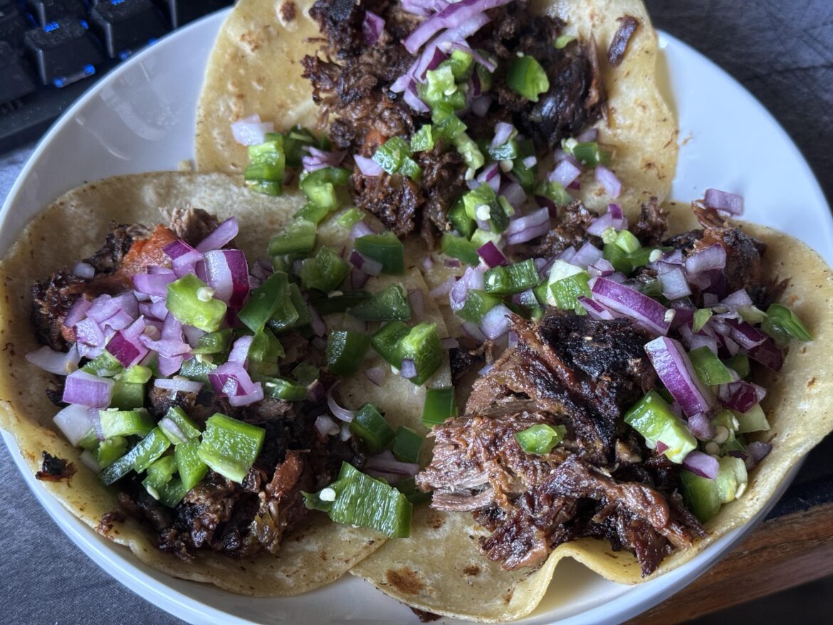 Braised, then fried leg of lamb tacos with red onion and jalapeno.