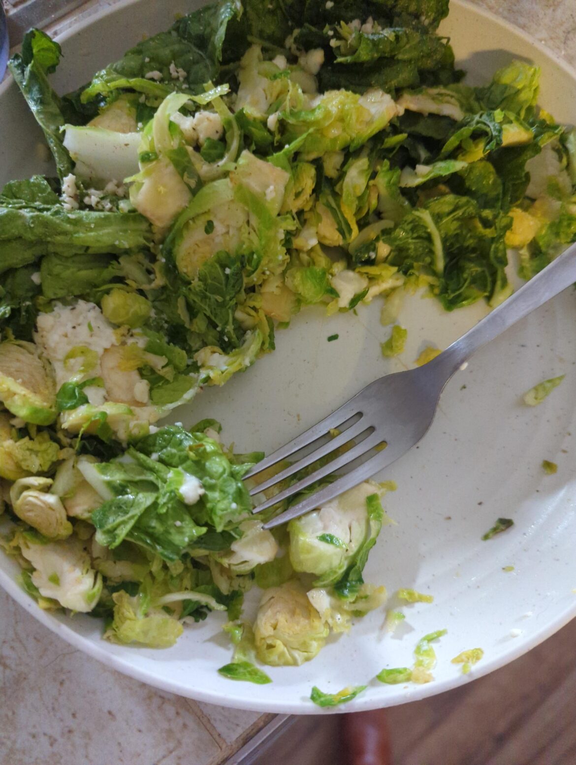 A bag of shaved brussels+ 3 cabbage leaves on the skillet (+ feta and ricotta)
