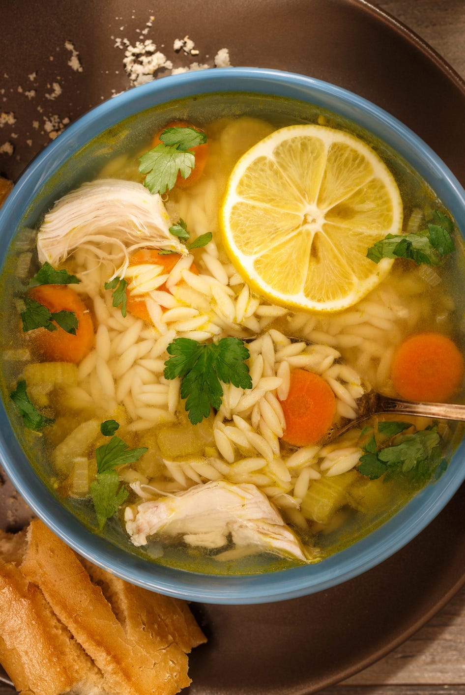 Bowl of Lemon Chicken Orzo Soup Rustic Style