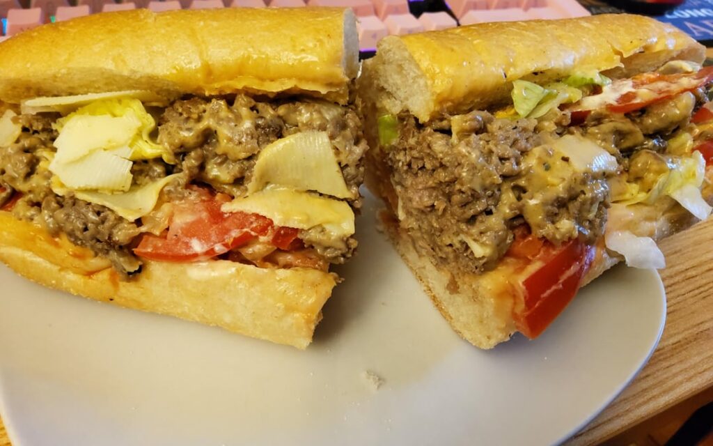 Chopped cheese on a hoagie roll.