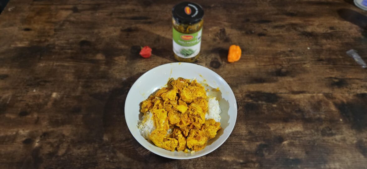 Ashari Chicken Curry with Habaneros, Chili Pickle, homegrown Scorpion Peppers, and Coconut Milk