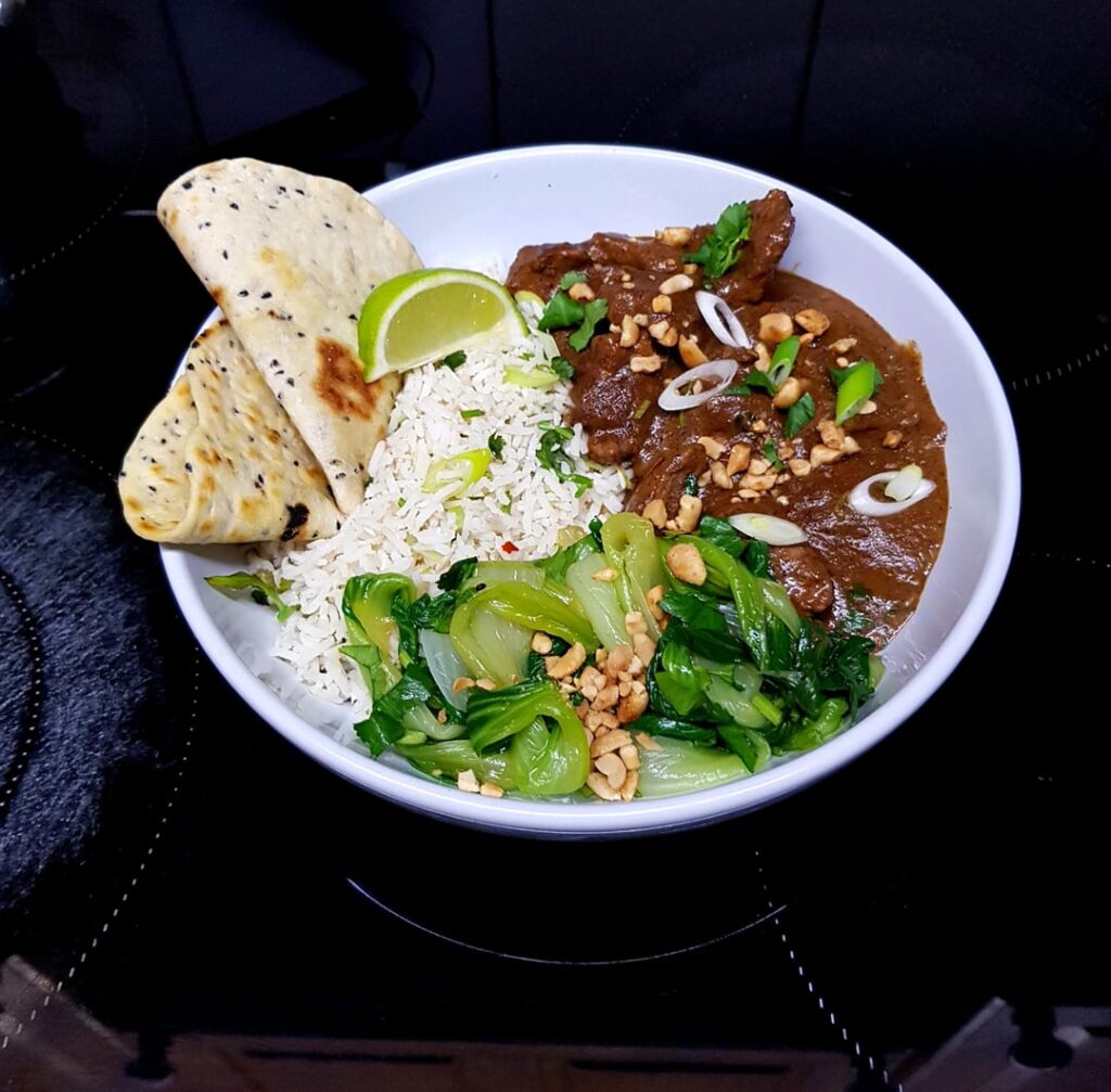 From Scratch Pork Massaman Curry, Coconut and Lime Rice, Saucy Pak Choi with Peanuts and Quick Flat Bread. Finished with Fresh Coriander and Toasted Peanuts.
