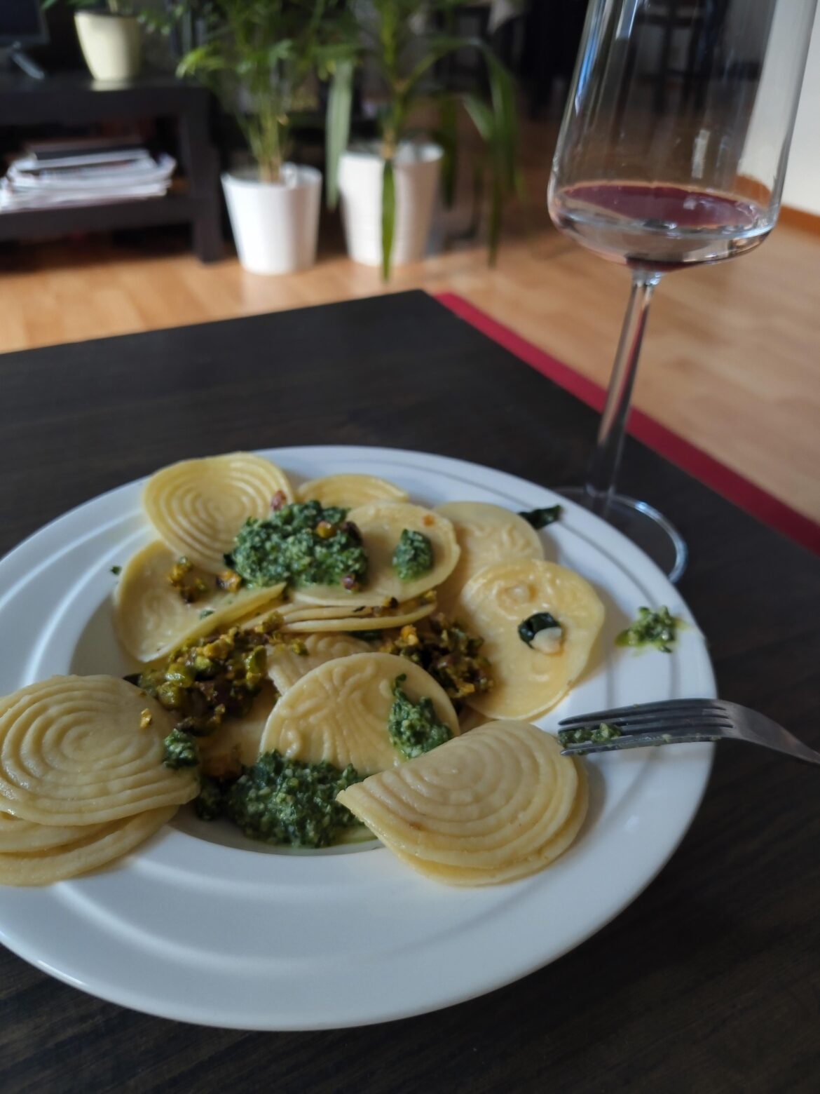 Corzetti pasta with pistachio pesto and basil pesto.