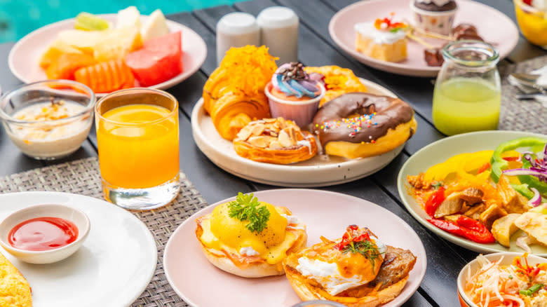 A classic brunch spread featuring egg dishes, fruit, and pastries.