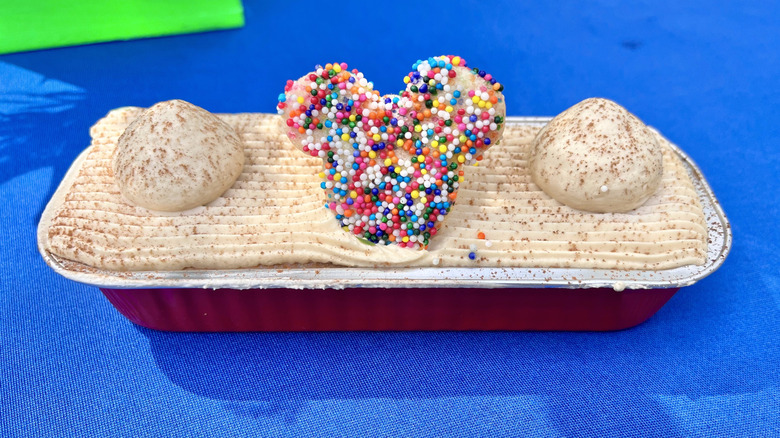 Close-up of the Café de Olla Tres Leches Cake on a blue tabletop